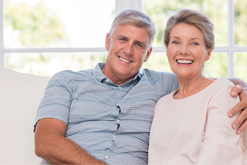 Happy Couple after full jaw dental implant treatment